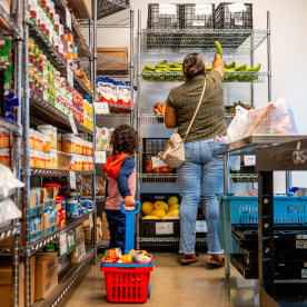 A family picks up food.