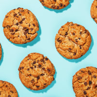 Chocolate chip cookies on a blue background.